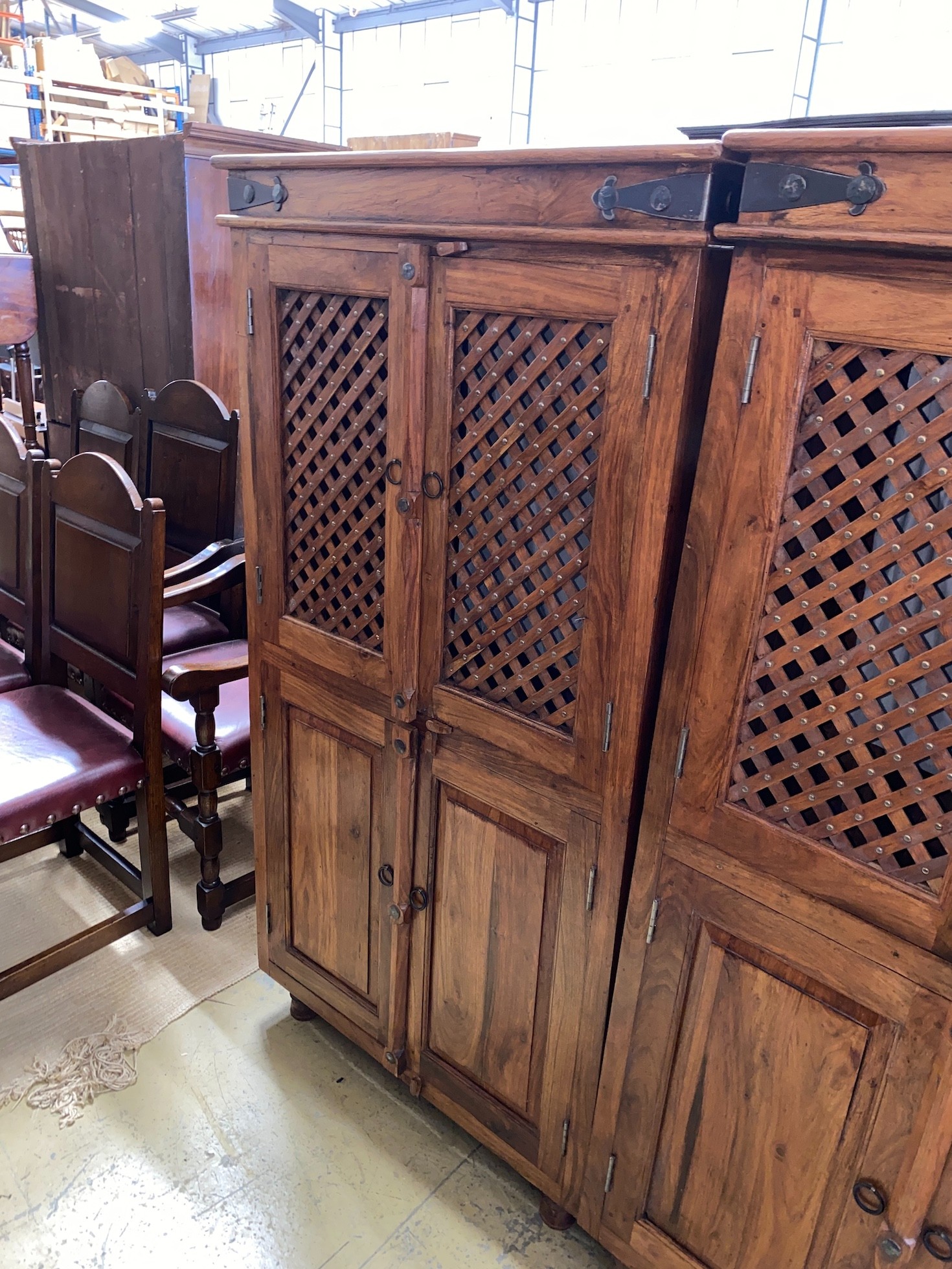 A pair of Indonesian metal mounted hardwood wardrobes, width 85cm, depth 55cm, height 161cm